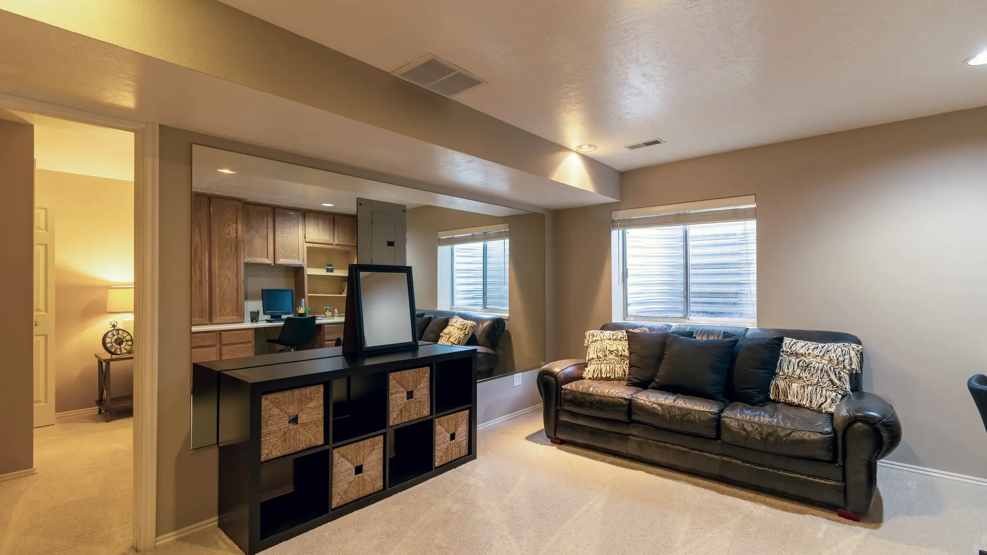 Finished basement family room with carpet, recessed lights and a garden-level window